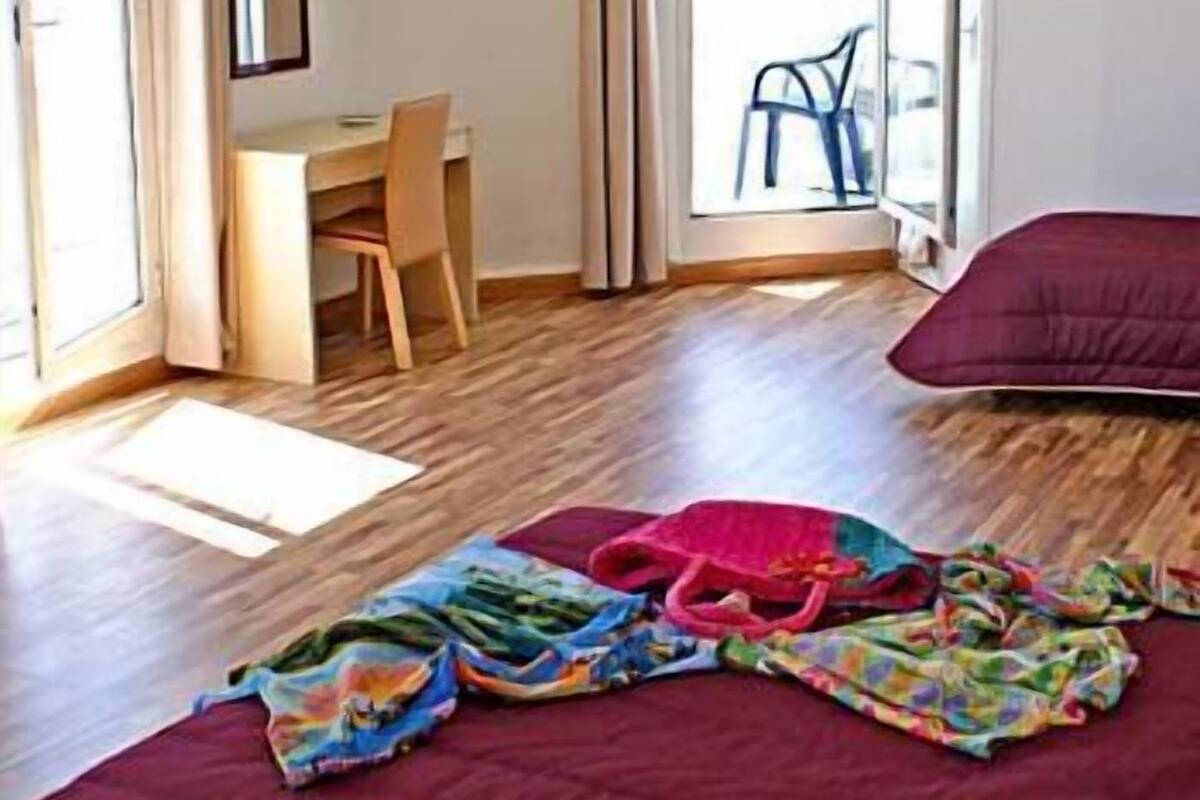 Desk, blackout curtains, iron/ironing board, rollaway beds