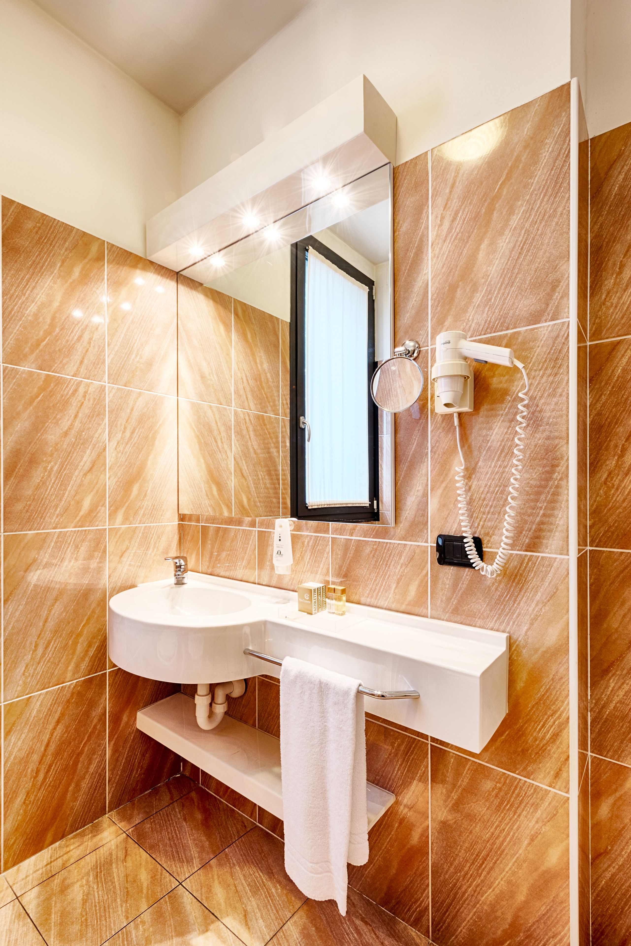 rainfall showerhead, hair dryer, bidet, towels