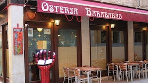A restaurant named "Osteria Baravbio" with outdoor seating and a distinctive red sculpture. - Bed & Breakfast Barababao (Venice)