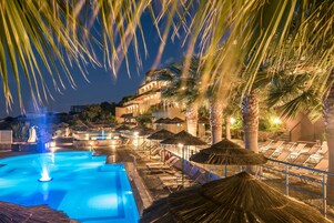 Seasonal outdoor pool, open 10:00 AM to 6:00 PM, pool umbrellas