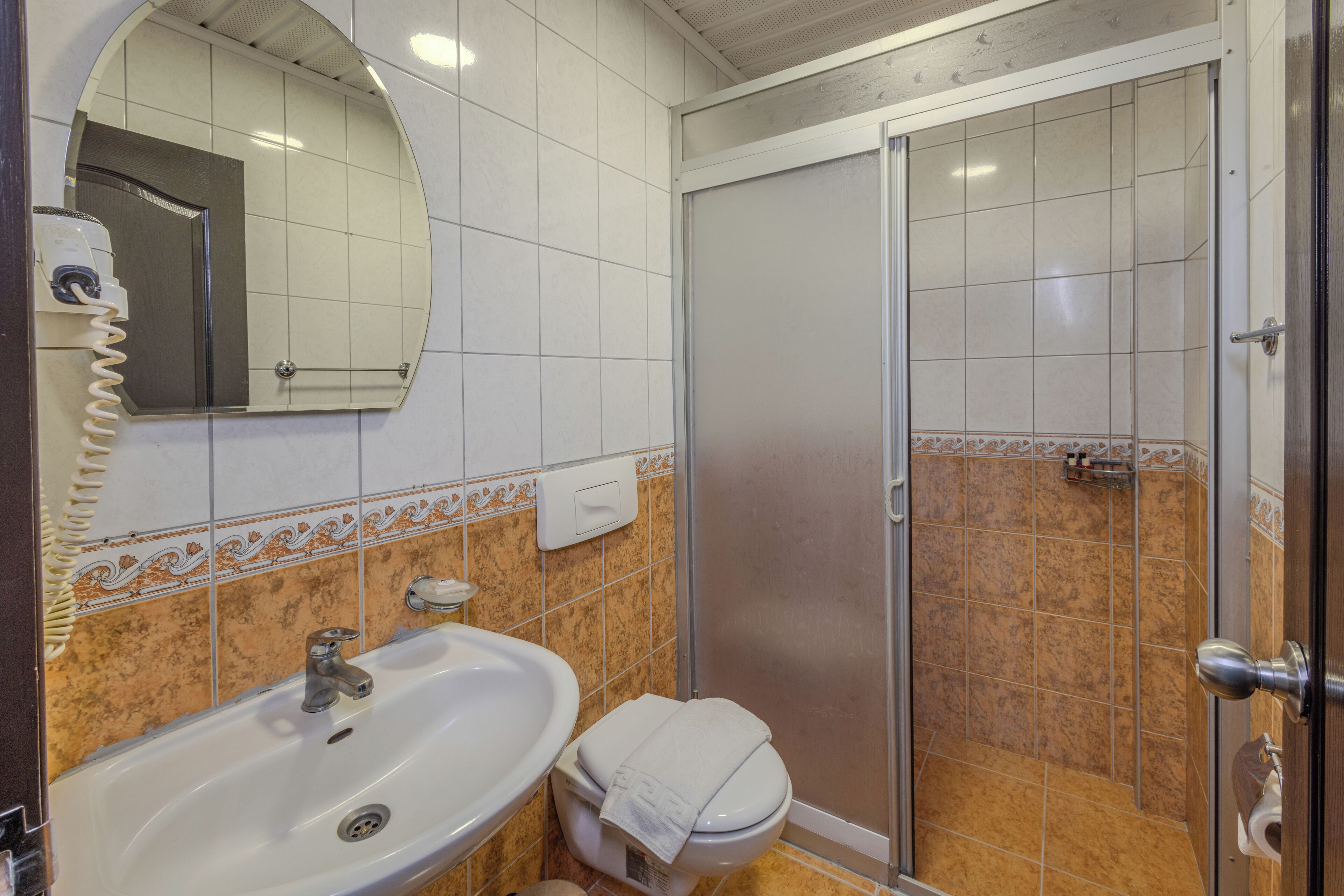 standard room | bathroom | shower, free toiletries, hair dryer, slippers