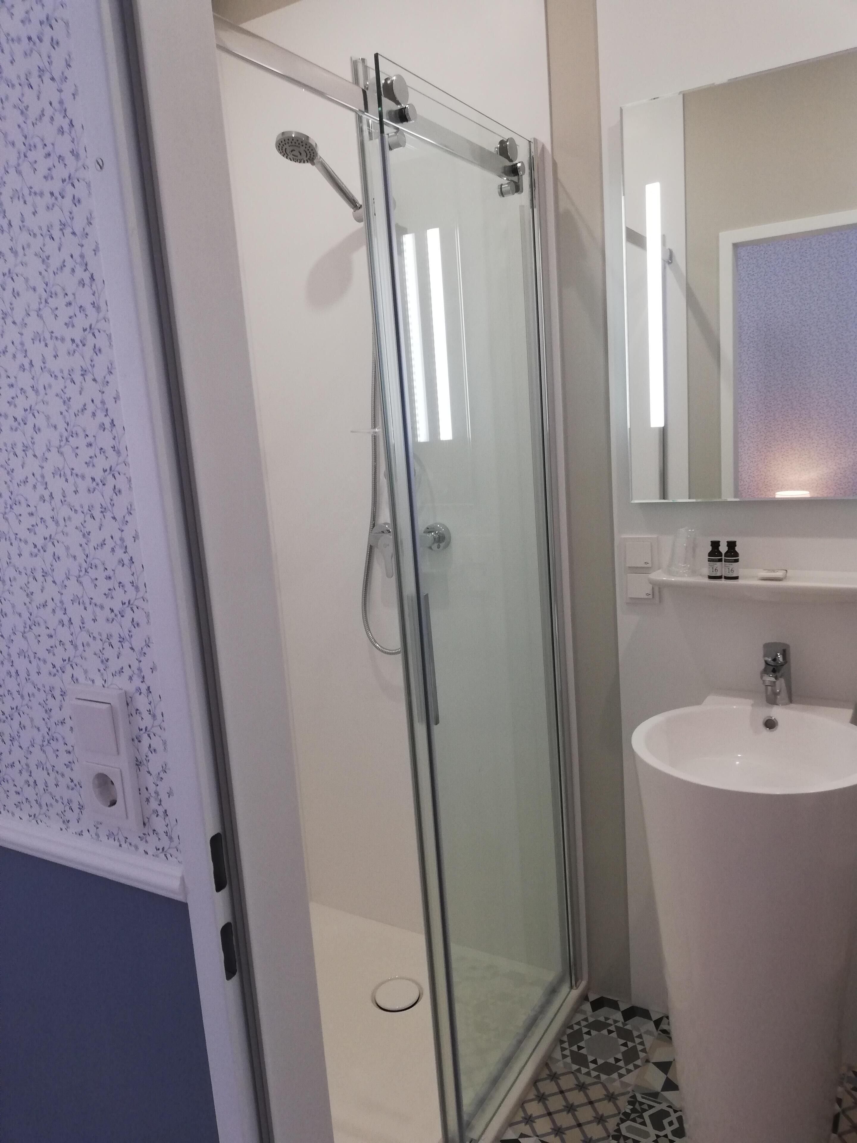 superior double room | bathroom | shower, free toiletries, hair dryer, towels