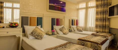 Triple Room | Premium bedding, minibar, in-room safe, desk
