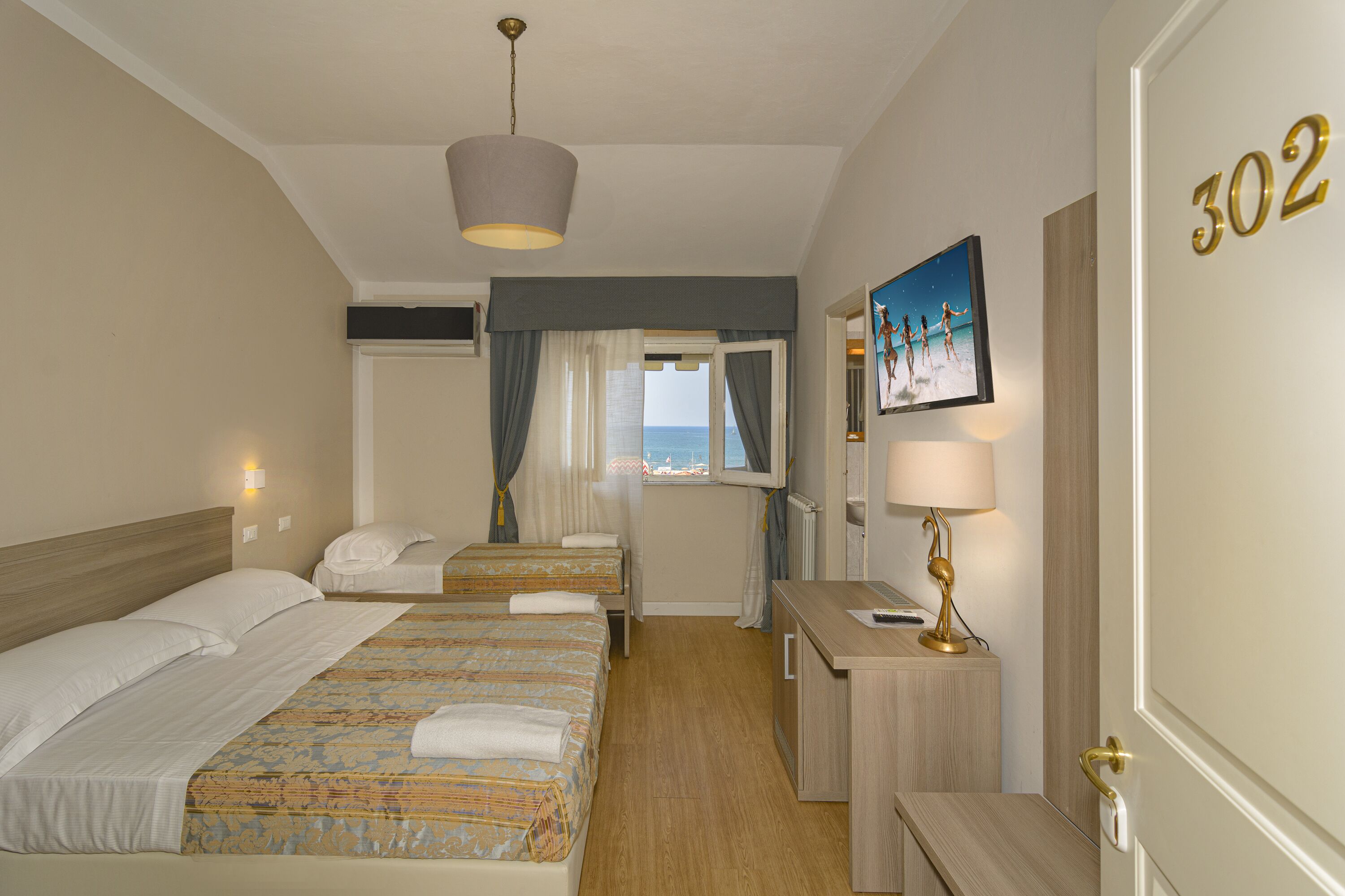 triple room, sea view | hypo-allergenic bedding, minibar, in-room safe, free wifi