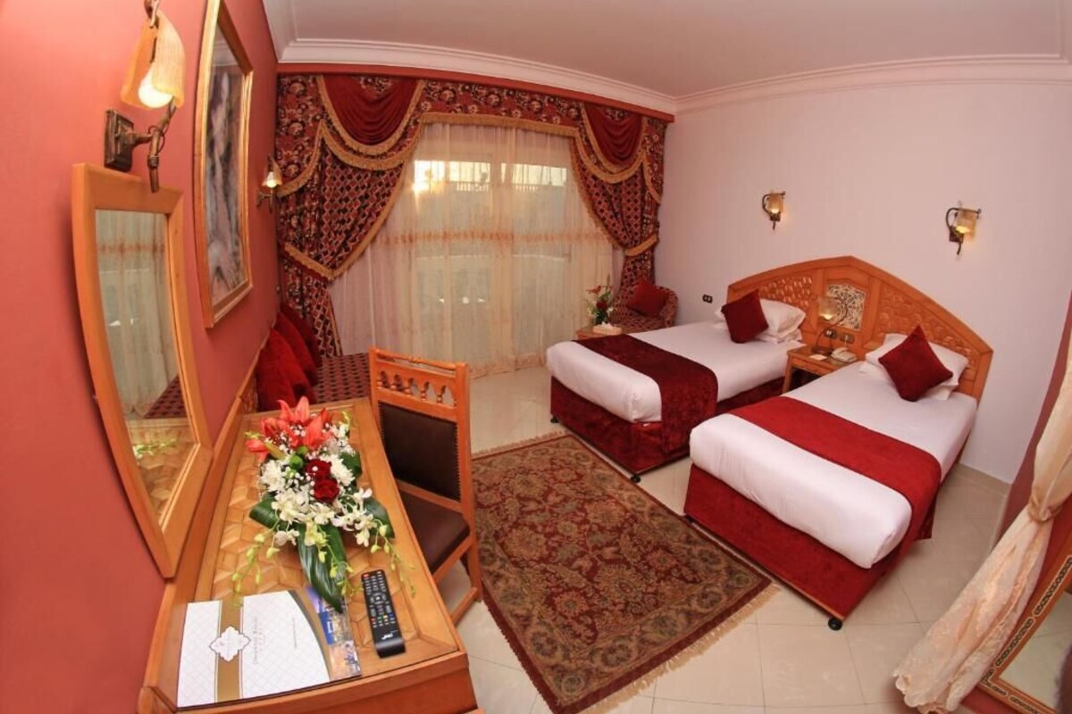 Superior Triple Room, Pool View | Egyptian cotton sheets, minibar, in-room safe, desk
