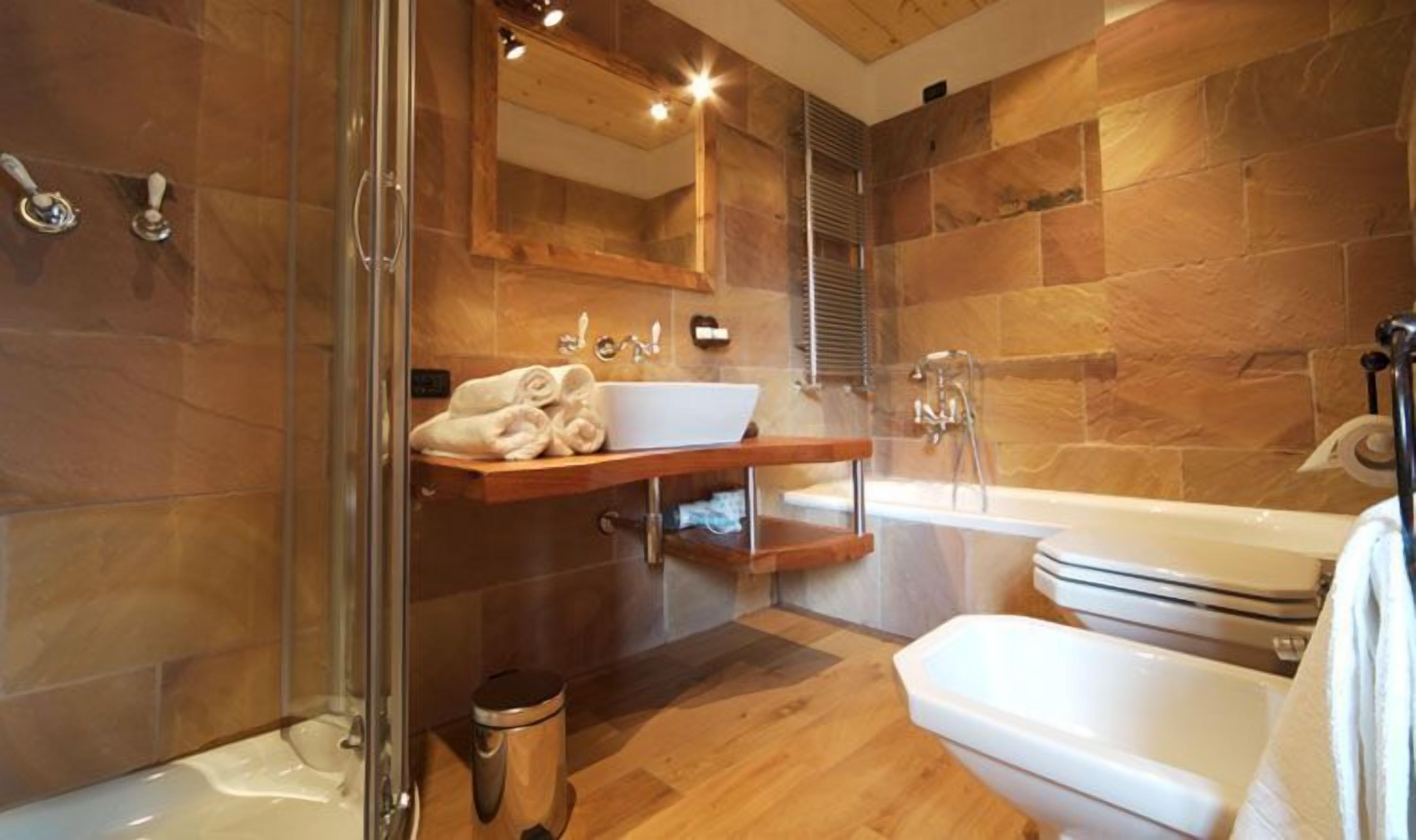 separate bathtub and shower, rainfall showerhead, hair dryer, bathrobes