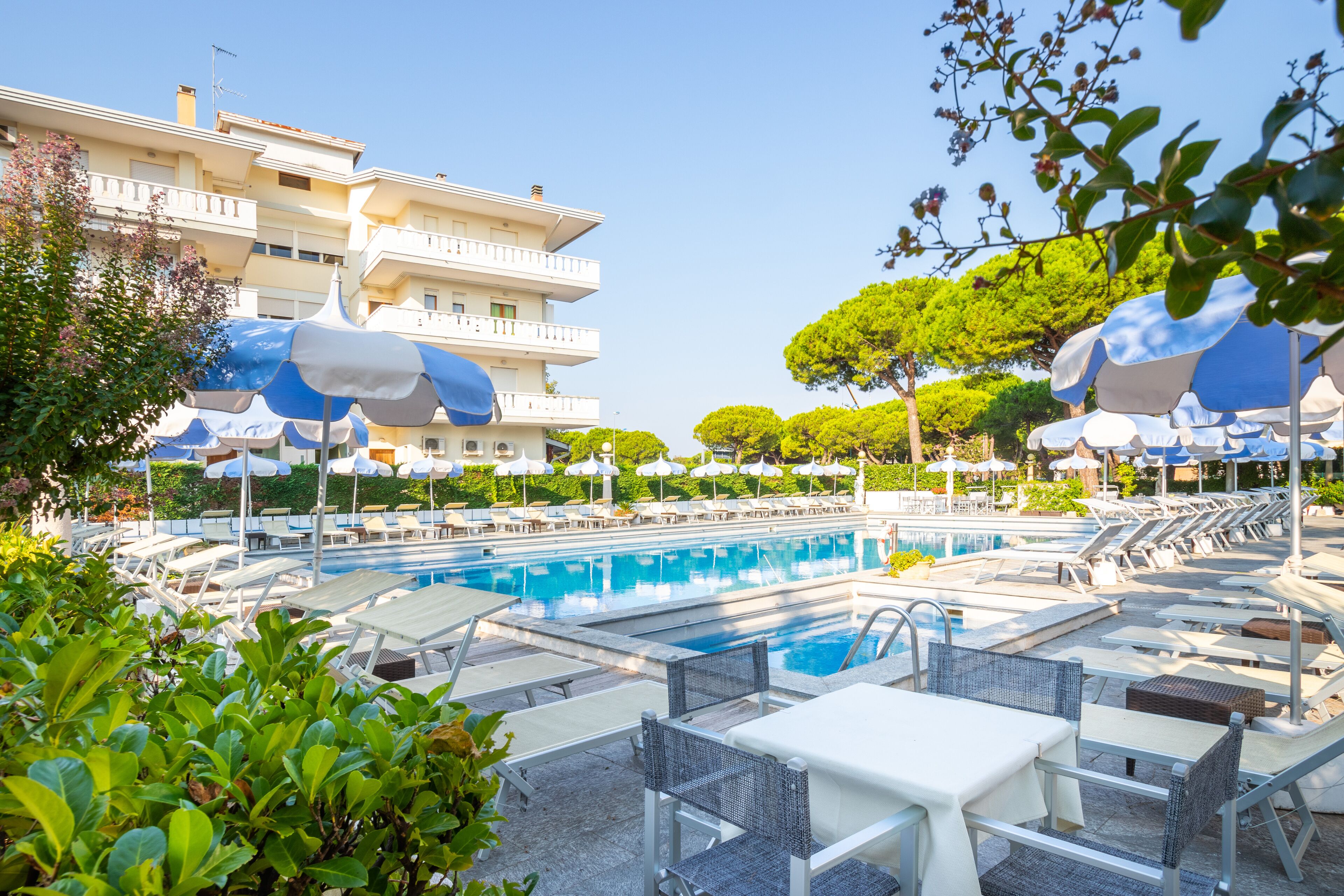 seasonal outdoor pool, open 8:00 am to 8:00 pm, pool umbrellas