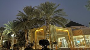A building with a traditional architectural style, featuring columns and a large entrance. - El Mouradi Tozeur (Tozeur)