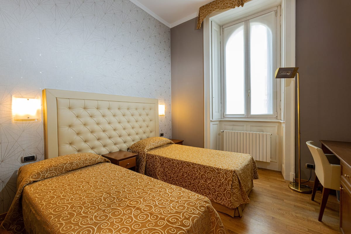 Family Apartment | 1 bedroom, down comforters, in-room safe, individually furnished