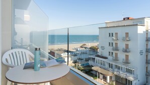 A balcony with a clear view of the beach and hotel buildings. - Majestic (Cervia)
