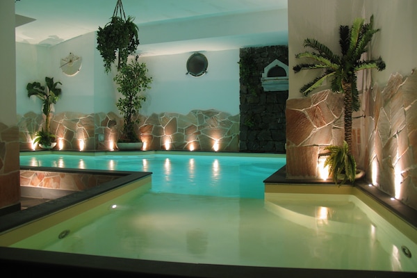 Indoor pool, seasonal outdoor pool, pool umbrellas, sun loungers