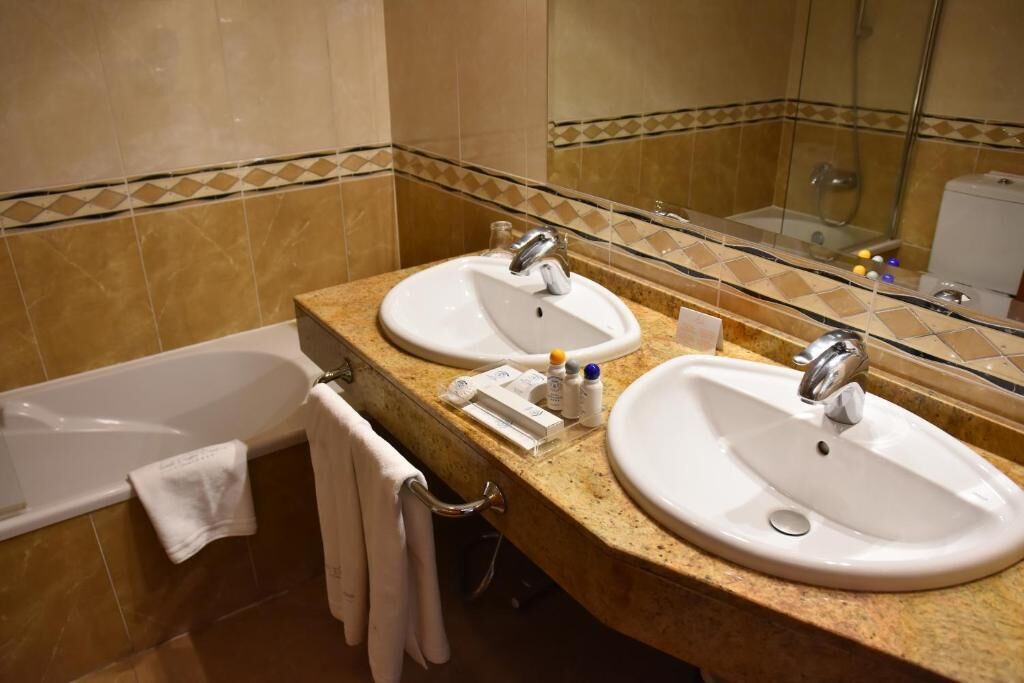 double room single use | bathroom | hair dryer, towels, soap, shampoo