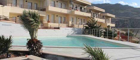 Seasonal outdoor pool, pool loungers