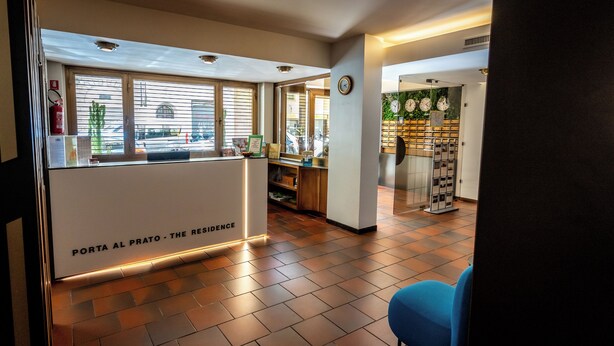 A reception area with a sign reading "PORTA AL PRATO - THE RESIDENCE". -  Residence Porta al Prato (Florence)