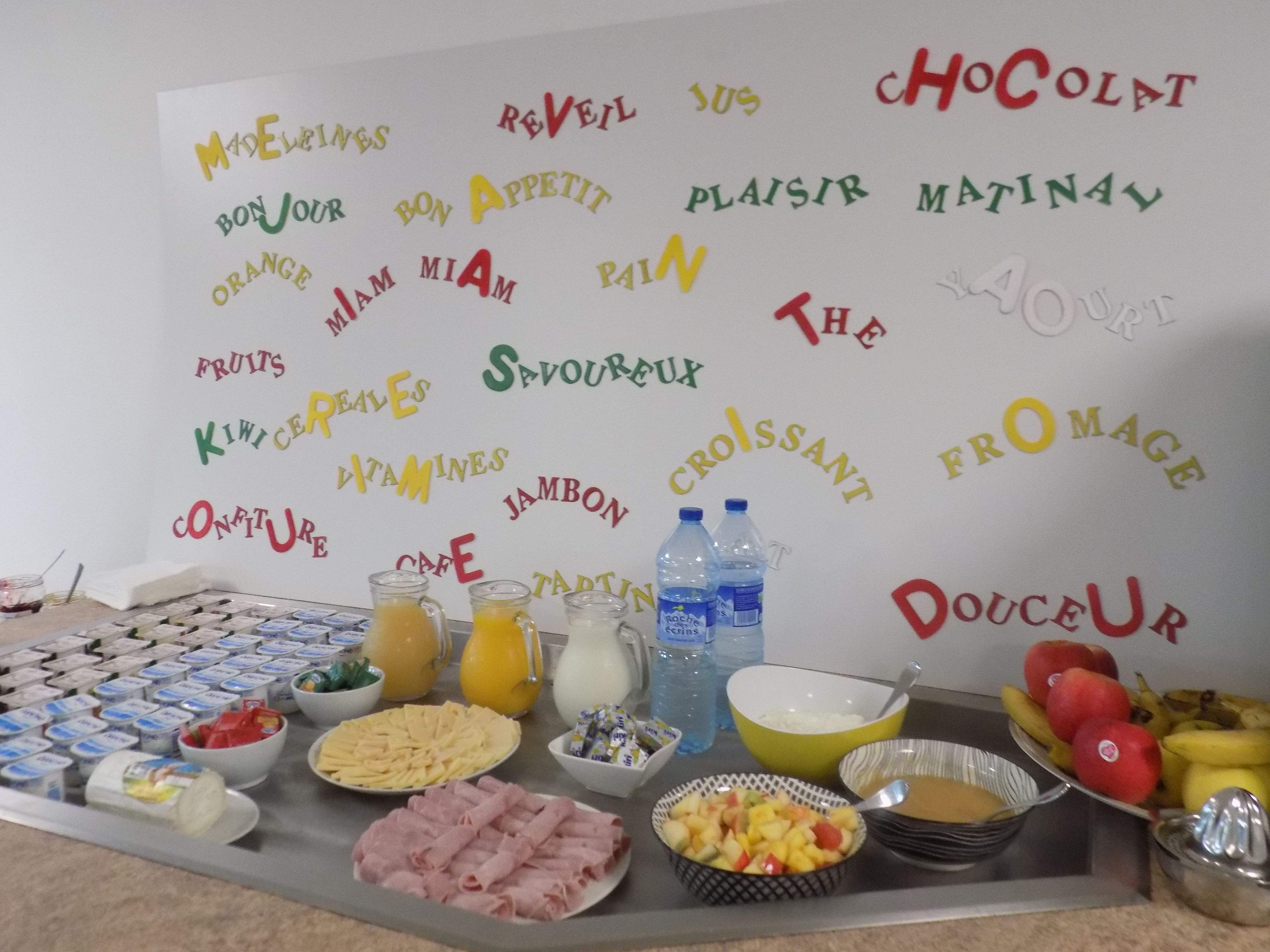 A breakfast buffet with various food items and beverages.