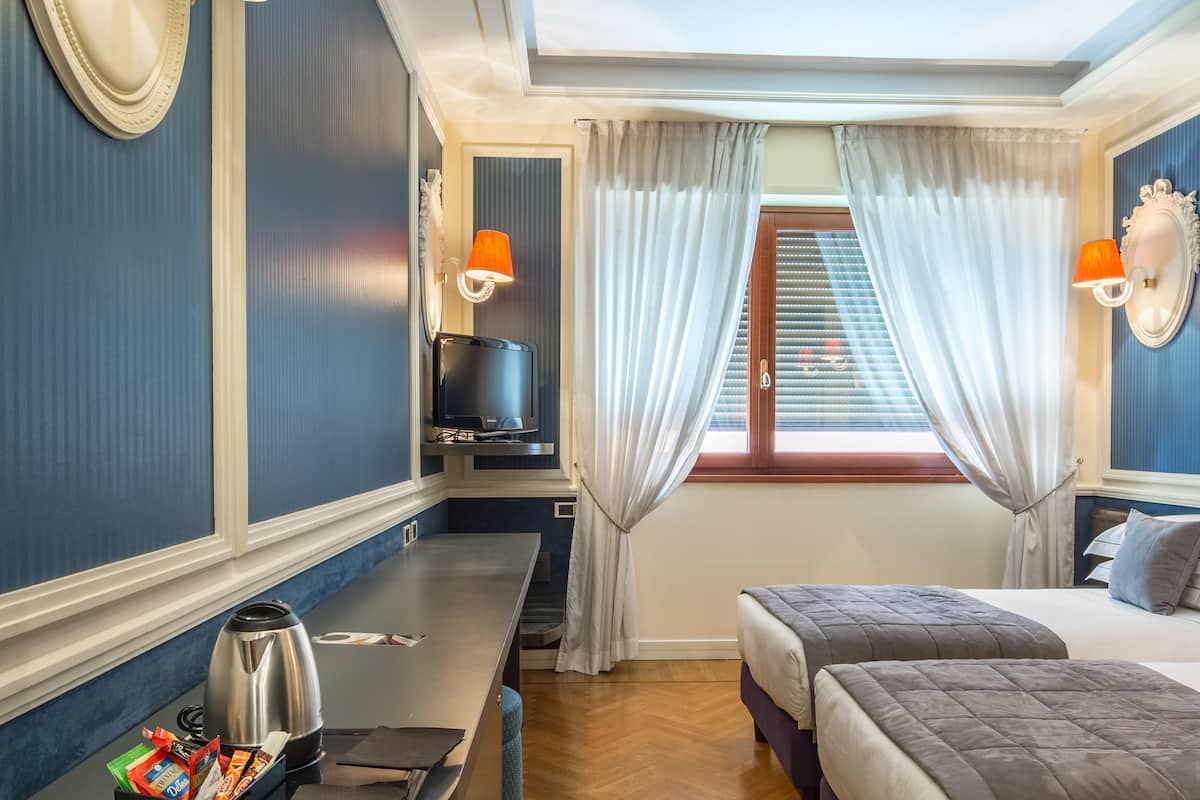 classic double or twin room | minibar, in-room safe, individually furnished, desk