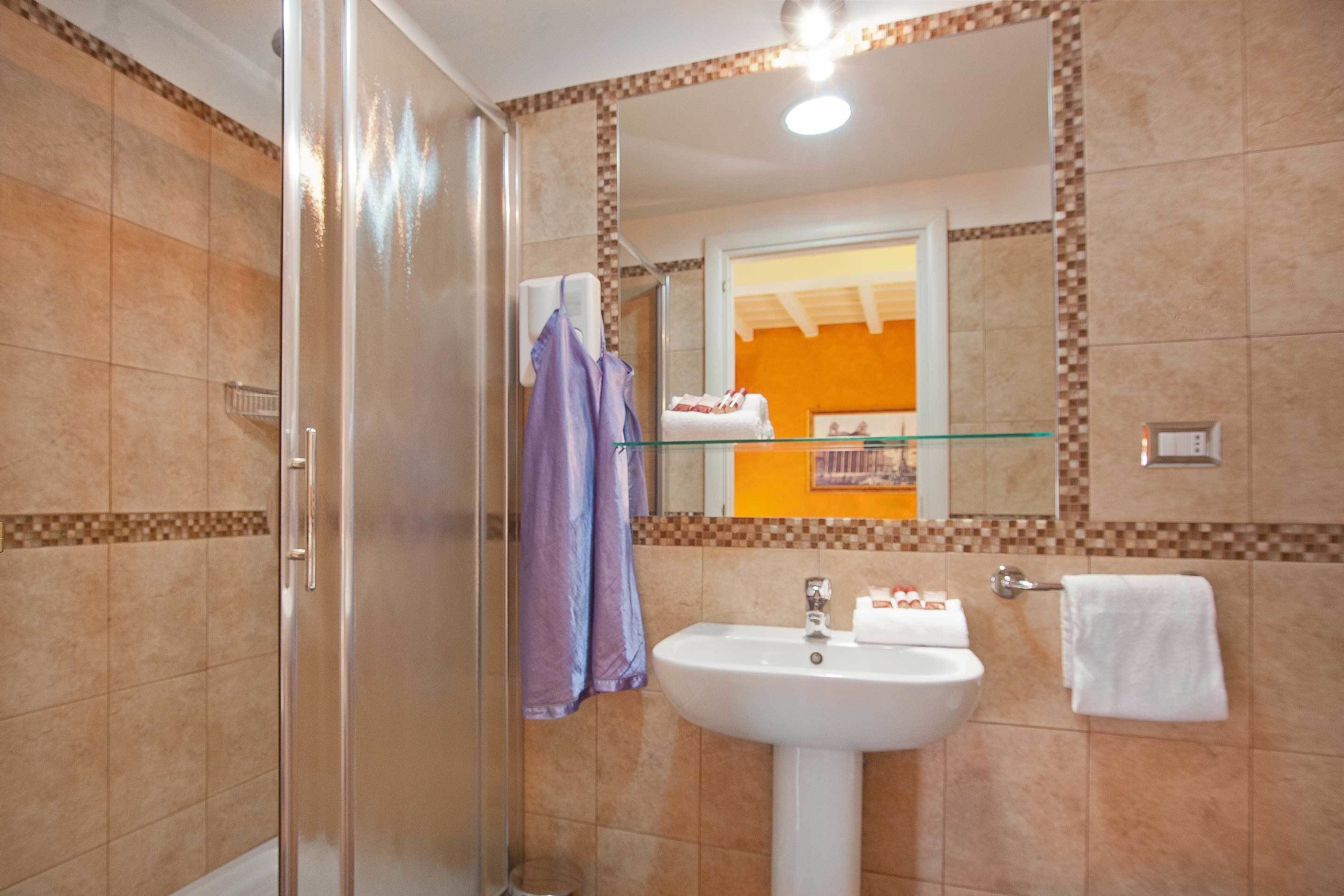 hair dryer, bathrobes, bidet, towels