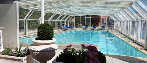 Seasonal outdoor pool, open 10:00 AM to 7:00 PM, pool loungers