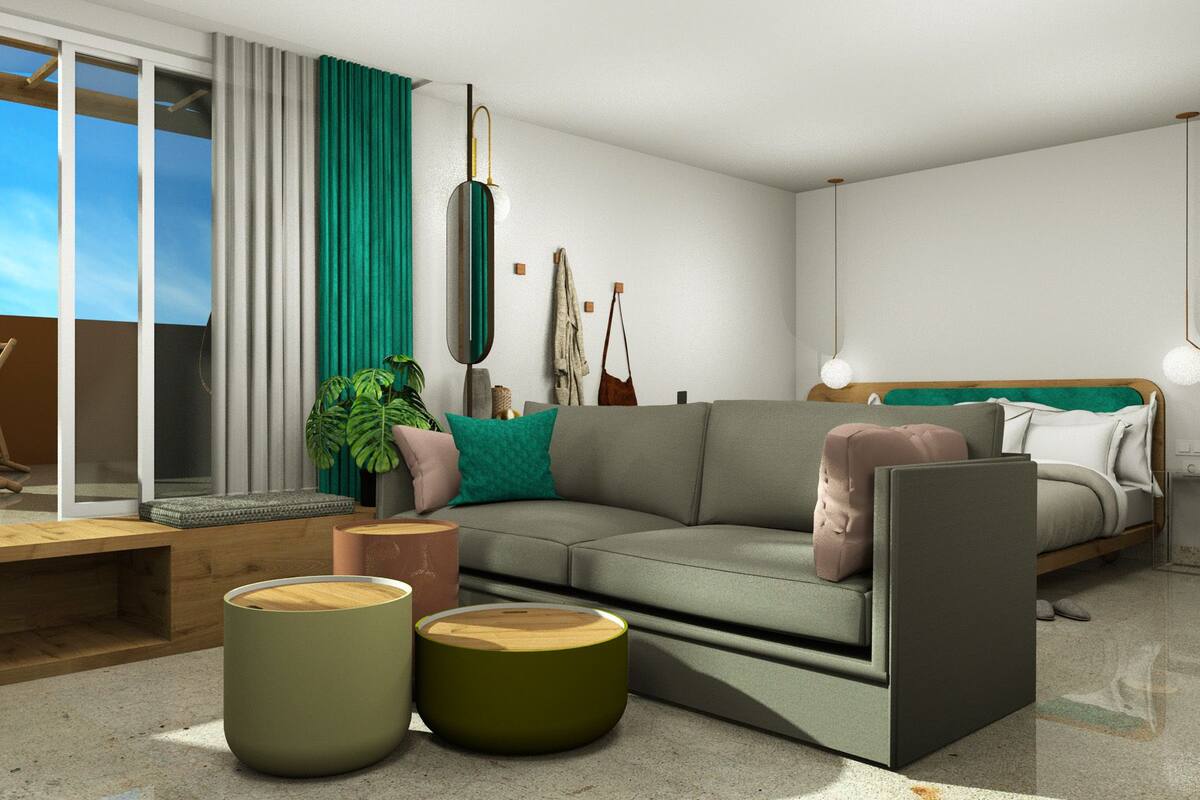 Una sala de estar moderna con sofá, mesa de centro y un balcón con una silla.
