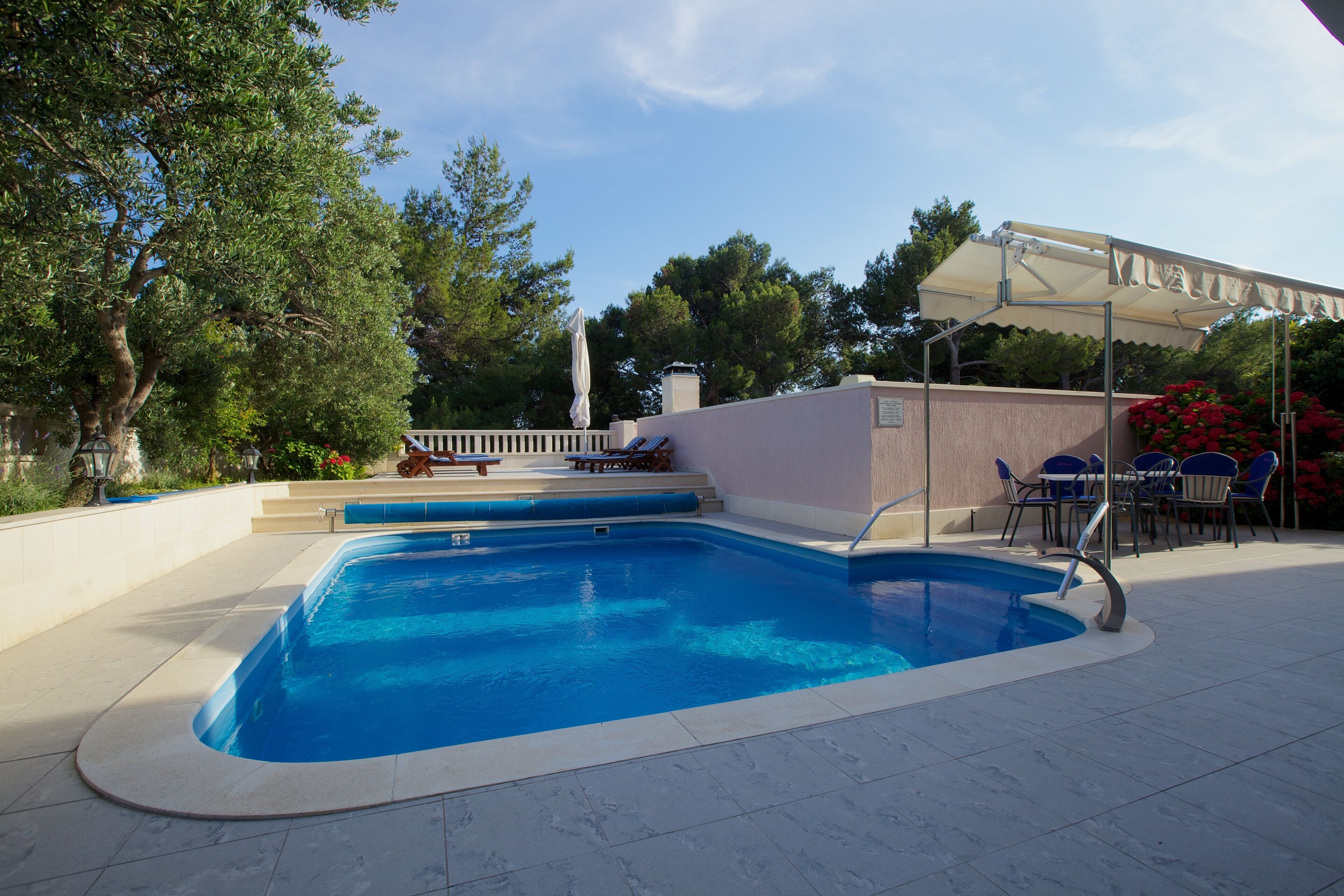 seasonal outdoor pool, open 10 am to 6 pm, pool umbrellas, pool loungers