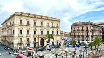 Experience the vibrant atmosphere of this historic urban square, surrounded by classical architecture and bustling with activity.