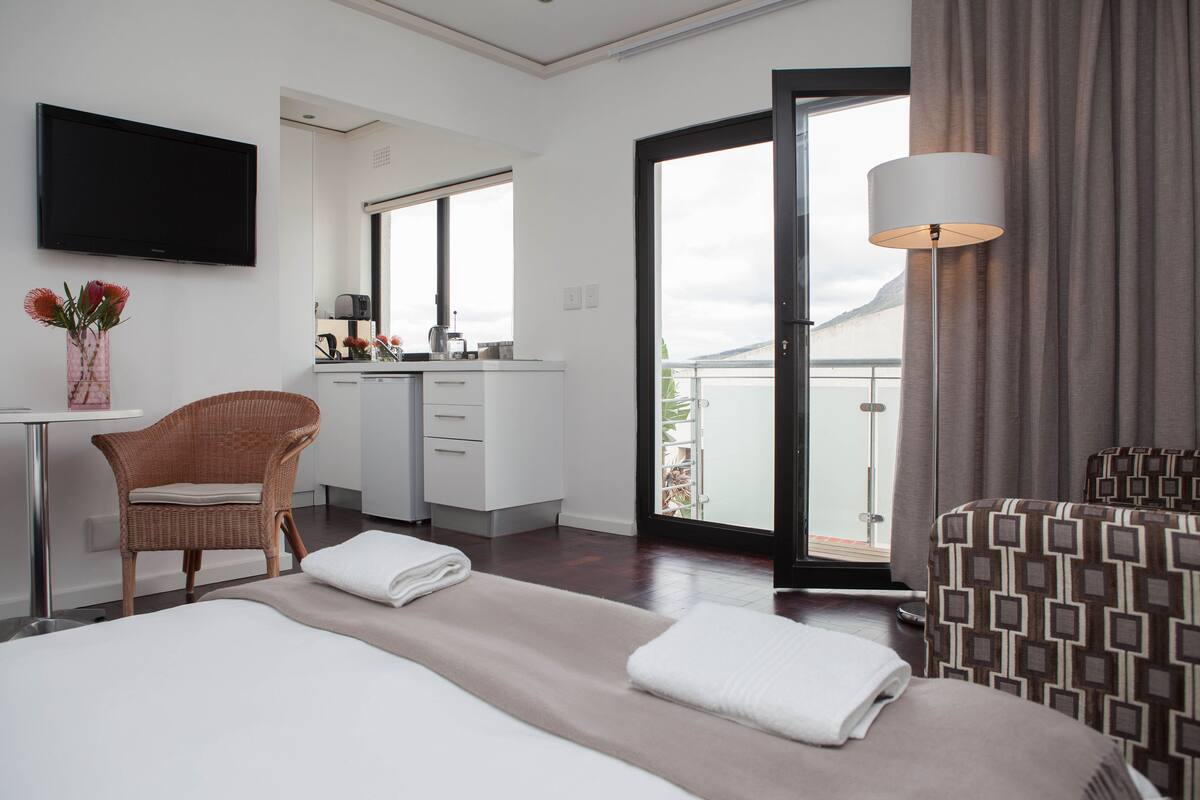 Apartment, City View | Minibar, desk, blackout curtains, iron/ironing board