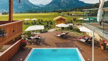 Outdoor pool, pool umbrellas, sun loungers