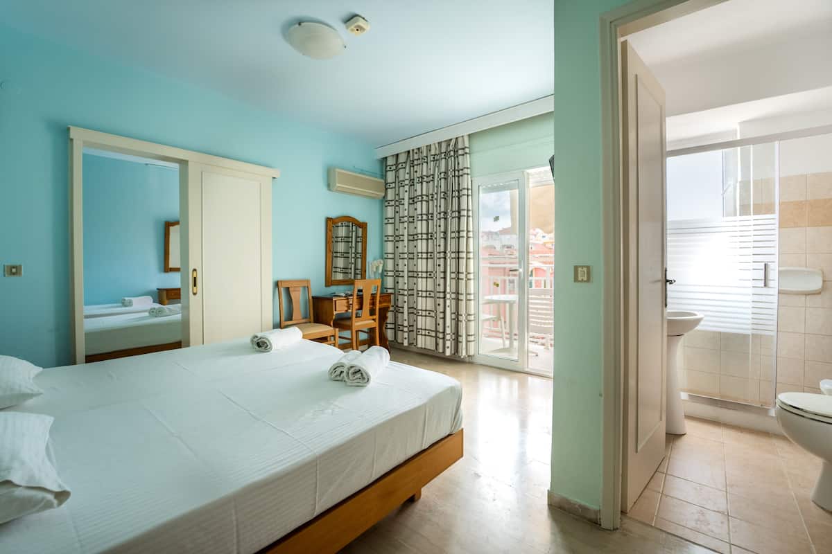 family room, 2 bedrooms, city view | 2 bedrooms, in-room safe, desk, blackout curtains