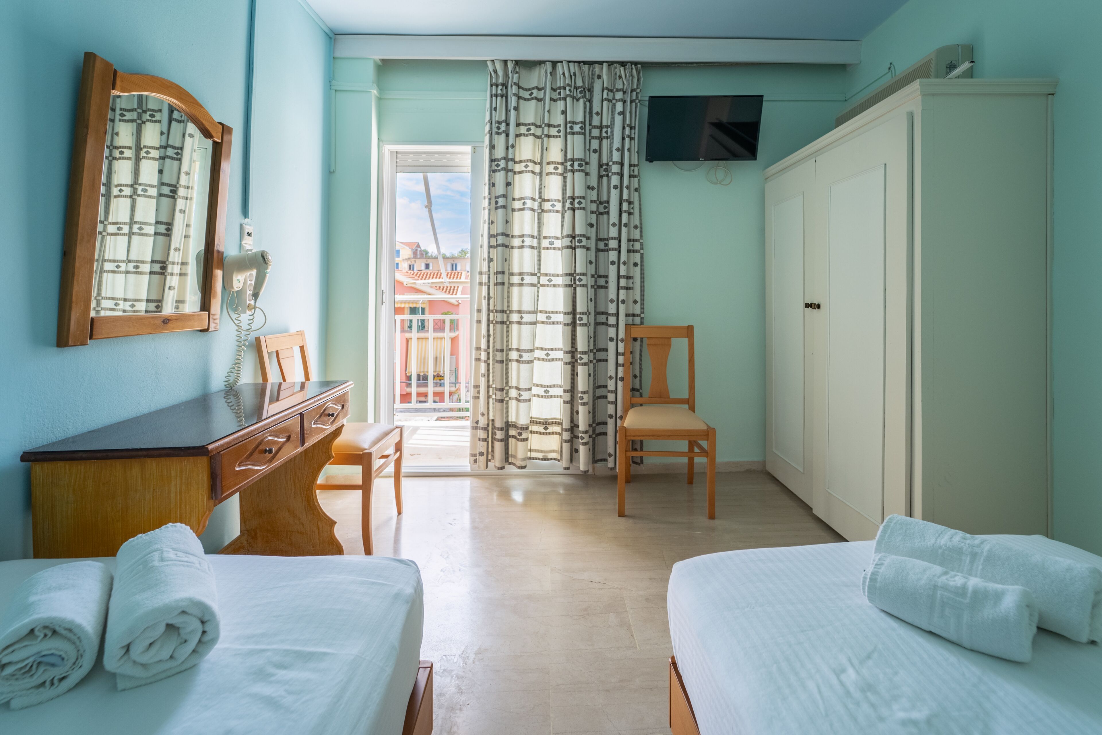 family room, 2 bedrooms, city view | 2 bedrooms, in-room safe, desk, blackout curtains