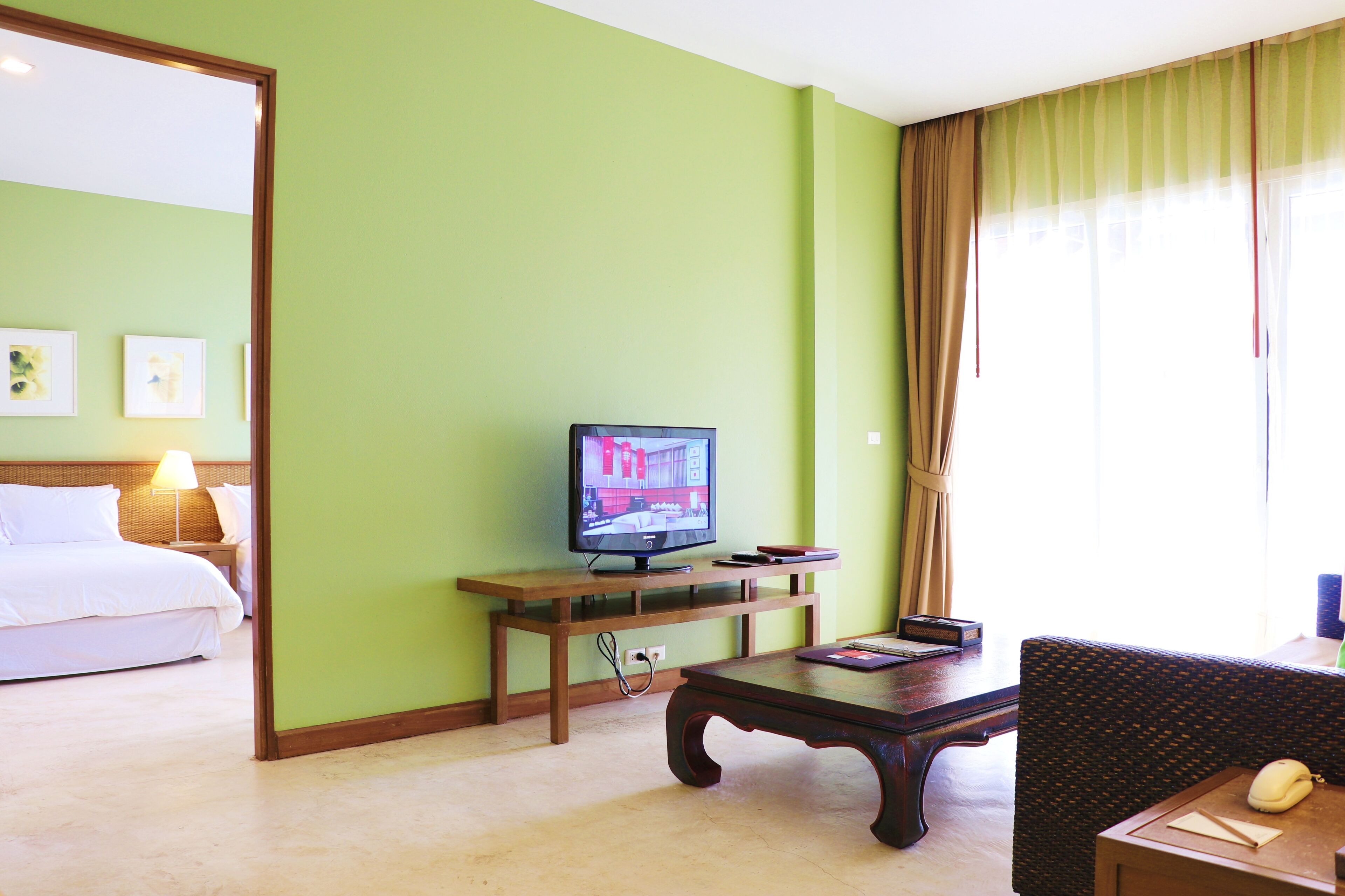 family suite, 2 double beds, garden view | living area | tv, dvd player