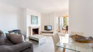 Apartment, 2 Bedrooms | Living room | Flat-screen TV