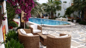 Seasonal outdoor pool, pool umbrellas, sun loungers