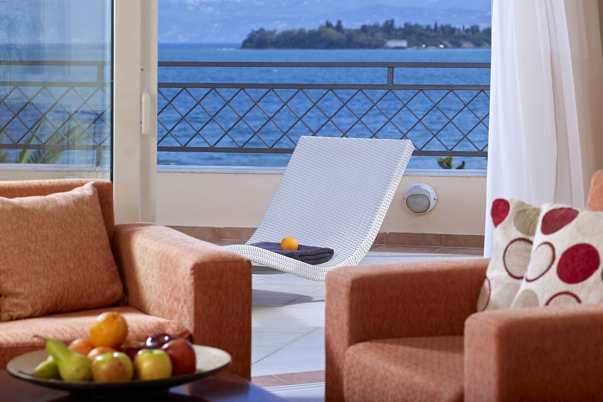 Executive Suite, 2 Bedrooms, Sea View | Living room | 21-inch LED TV with digital channels, TV