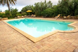 Seasonal outdoor pool, pool umbrellas, pool loungers