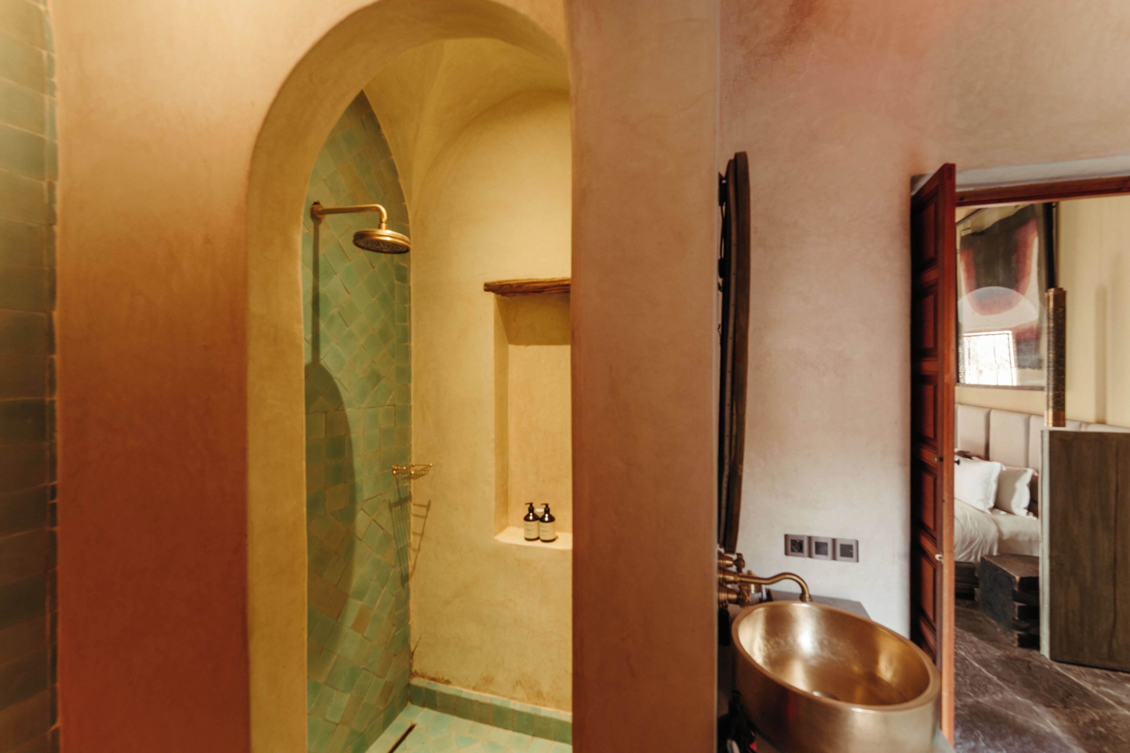 A bathroom with a bathtub, shower, and a mirror.