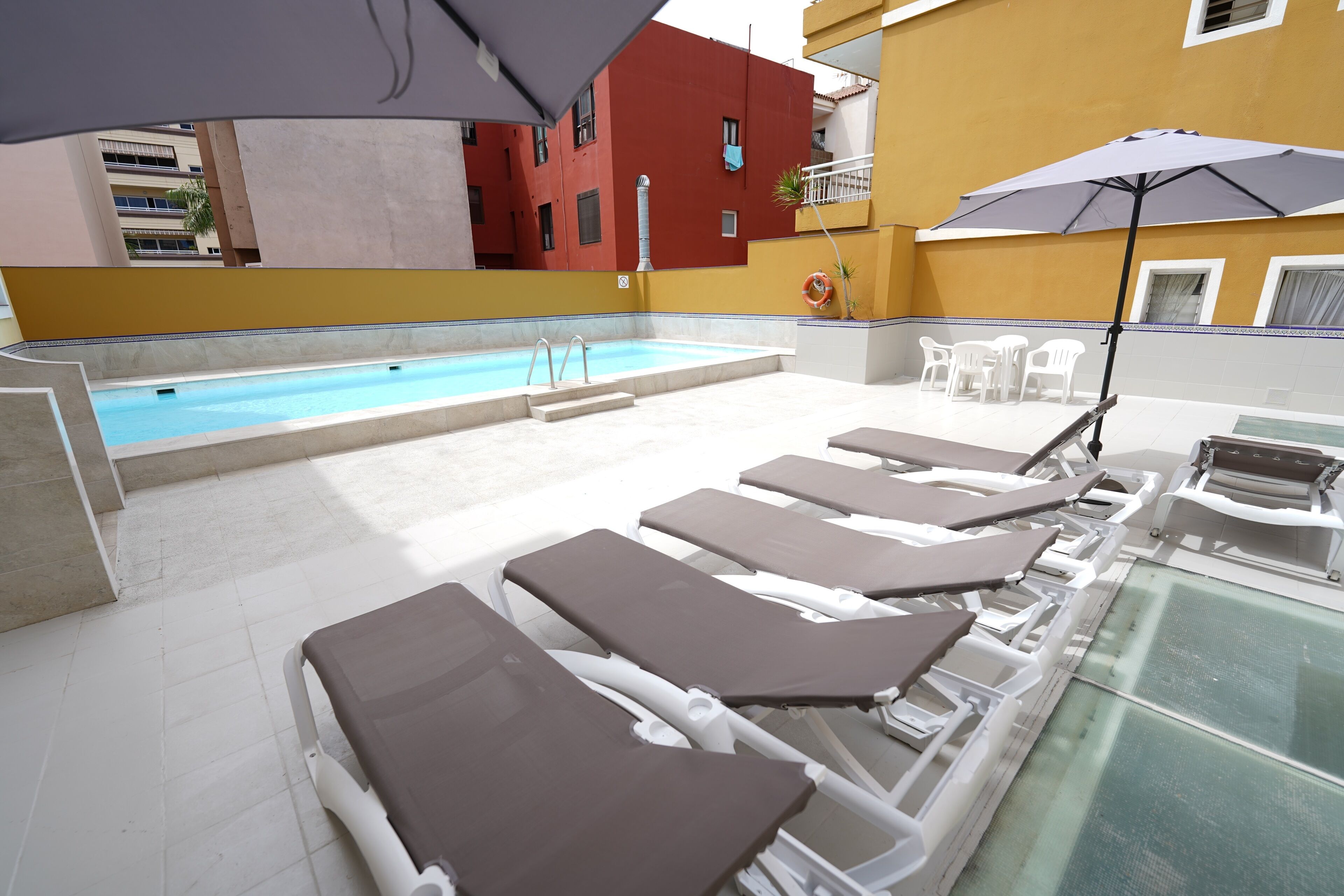 Outdoor pool, pool umbrellas, pool loungers