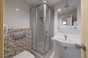 Shower, free toiletries, hair dryer, slippers
