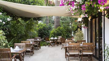 Breakfast, lunch served; local and international cuisine, pool views