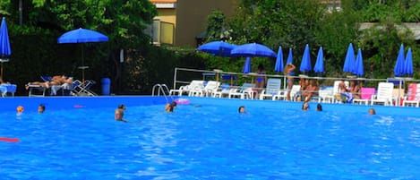 Seasonal outdoor pool, pool umbrellas, pool loungers