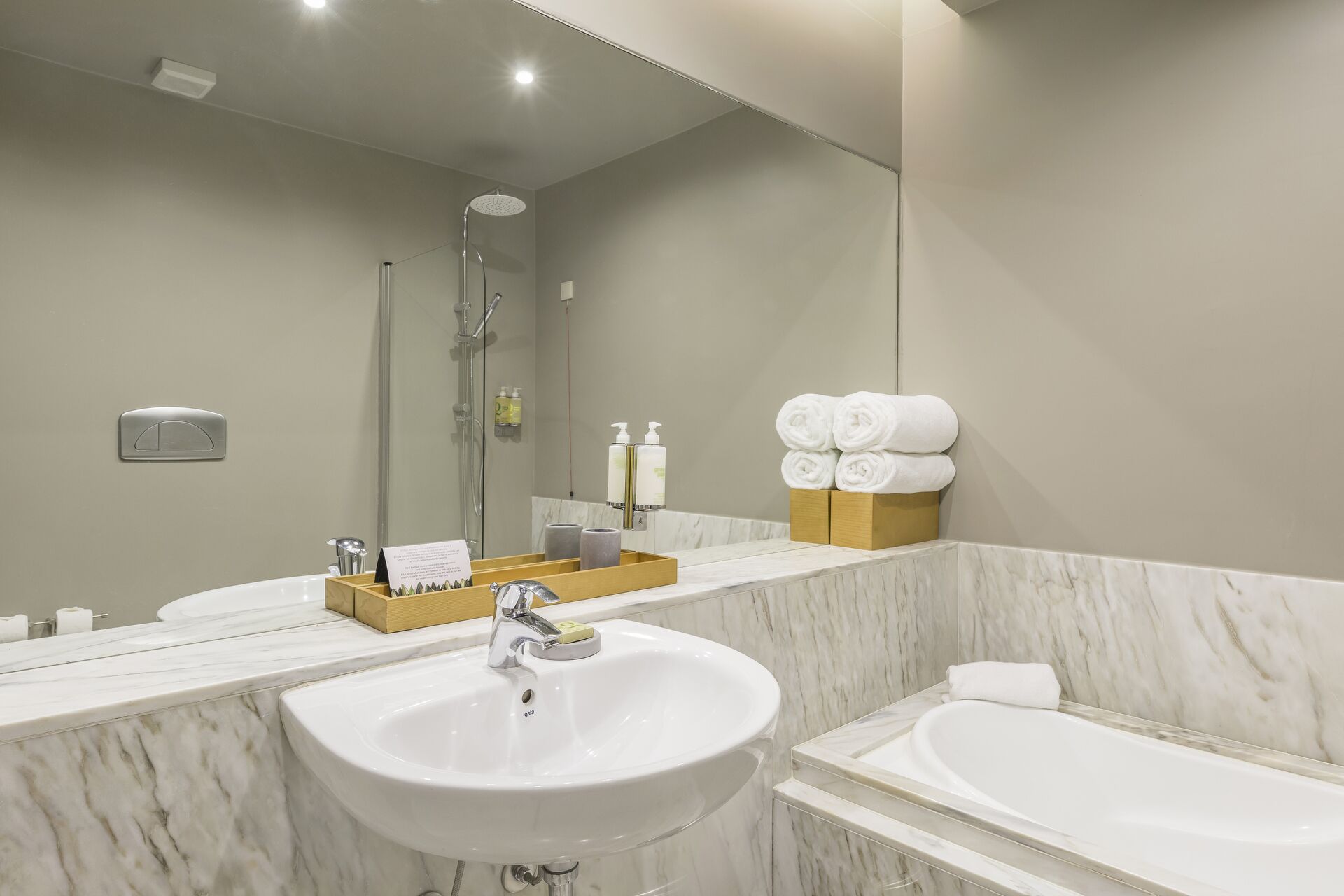 bathtub, hair dryer, bathrobes, bidet