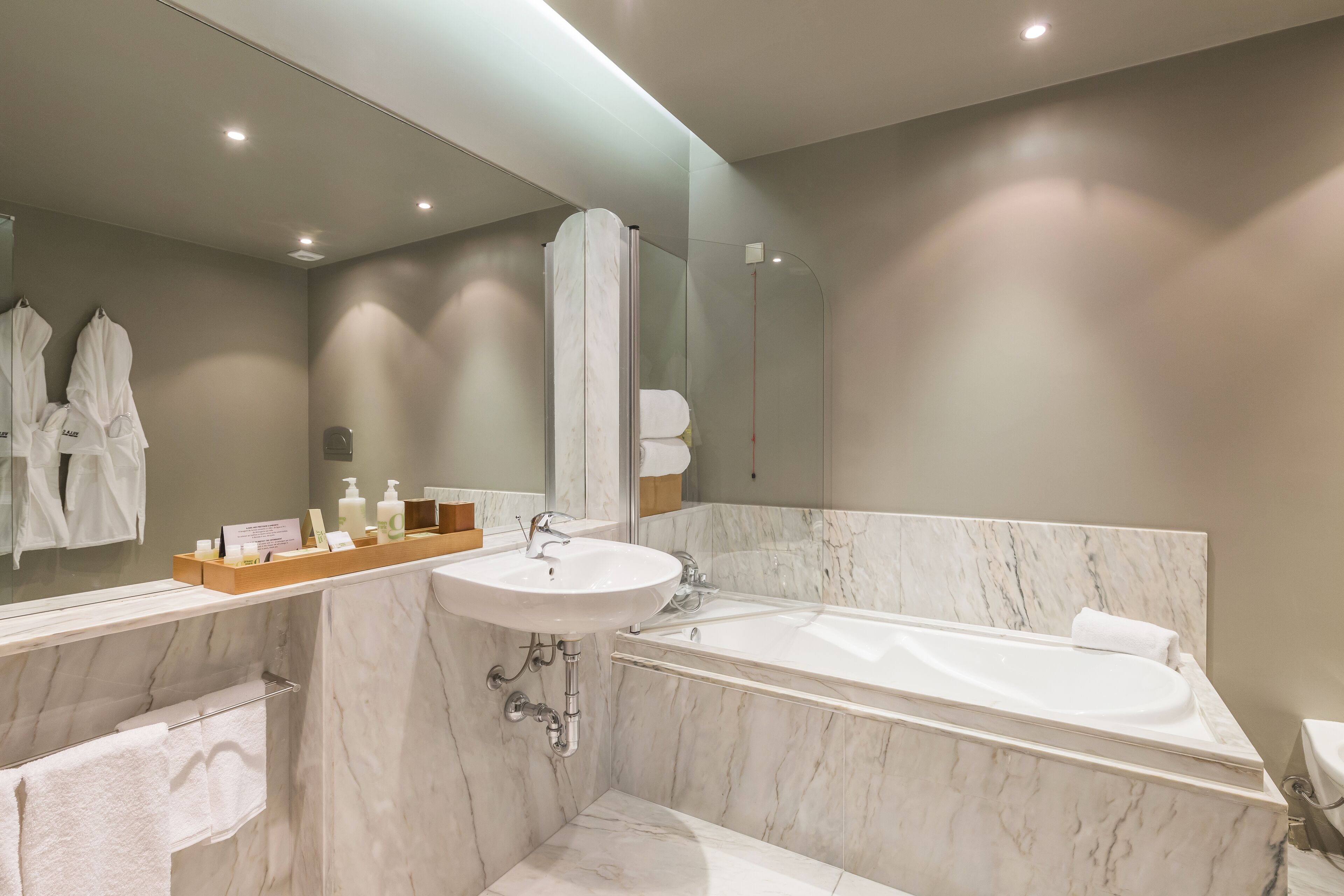 suite | bathroom | bathtub, hair dryer, bathrobes, bidet