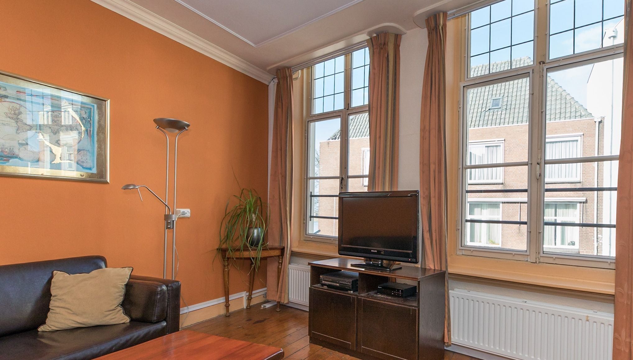 city apartment, 1 bedroom | living room | 65-inch smart tv with digital channels