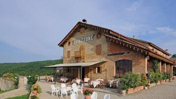 CAVAZZONE offers a traditional, rustic charm with a welcoming outdoor seating area.