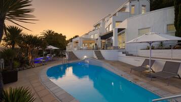 Outdoor pool, open 6:30 AM to 7:30 PM, pool umbrellas, pool loungers