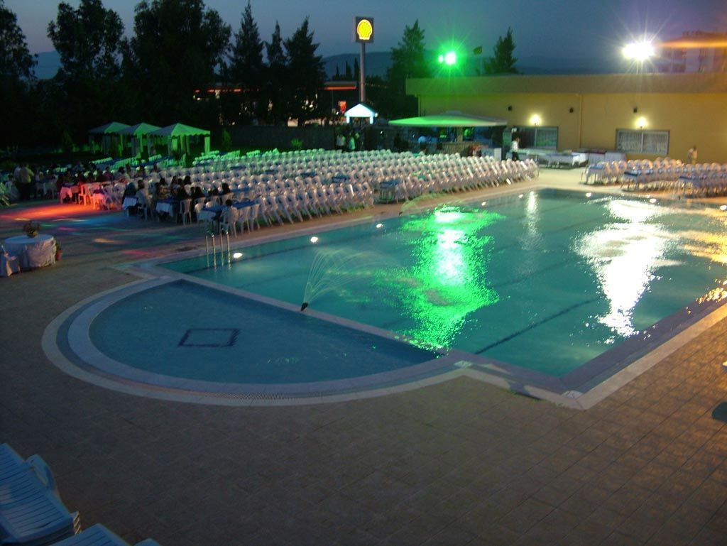 Seasonal outdoor pool, pool umbrellas, pool loungers