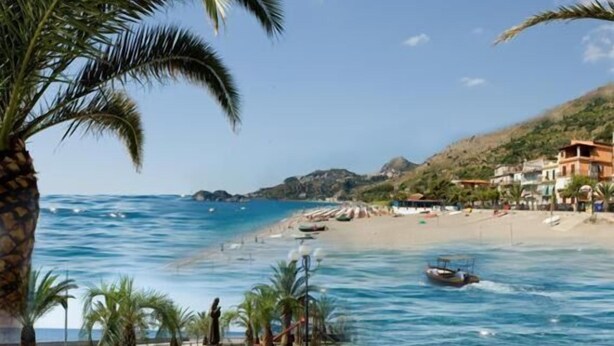 A coastal beach scene with clear blue waters, a sandy shore, and a few boats. There are palm trees and a statue in the foreground. - Casa Famiani Bed & Breakfast (Letojanni)