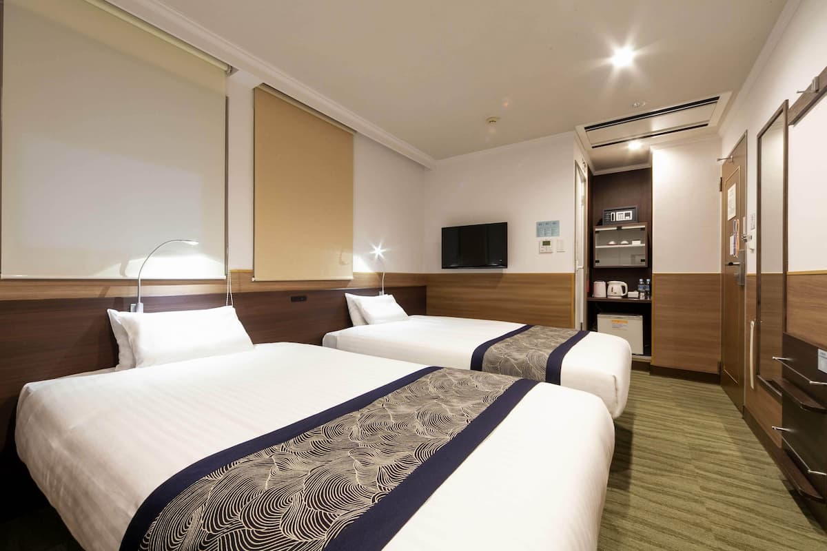 Habitación básica con 2 camas individuales, para no fumadores | Ropa de cama de alta calidad y camas con efecto memoria