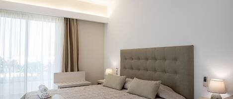 Suite Junior | 1 chambre, surmatelas, coffres-forts dans les chambres