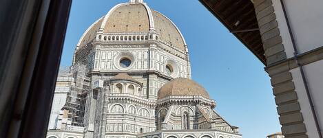 A view of the Florence Cathedral's facade, including its large dome and intricate architectural details.