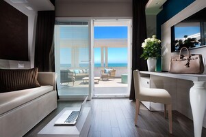 Luxury Suite (Stella) | Living area | 37-inch flat-screen TV with digital channels, TV